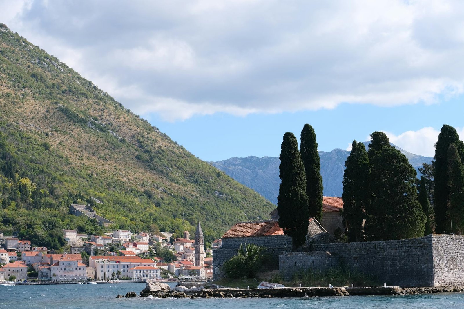 Picturesque coastal town and mountains by the bay in Kotor, Montenegro.