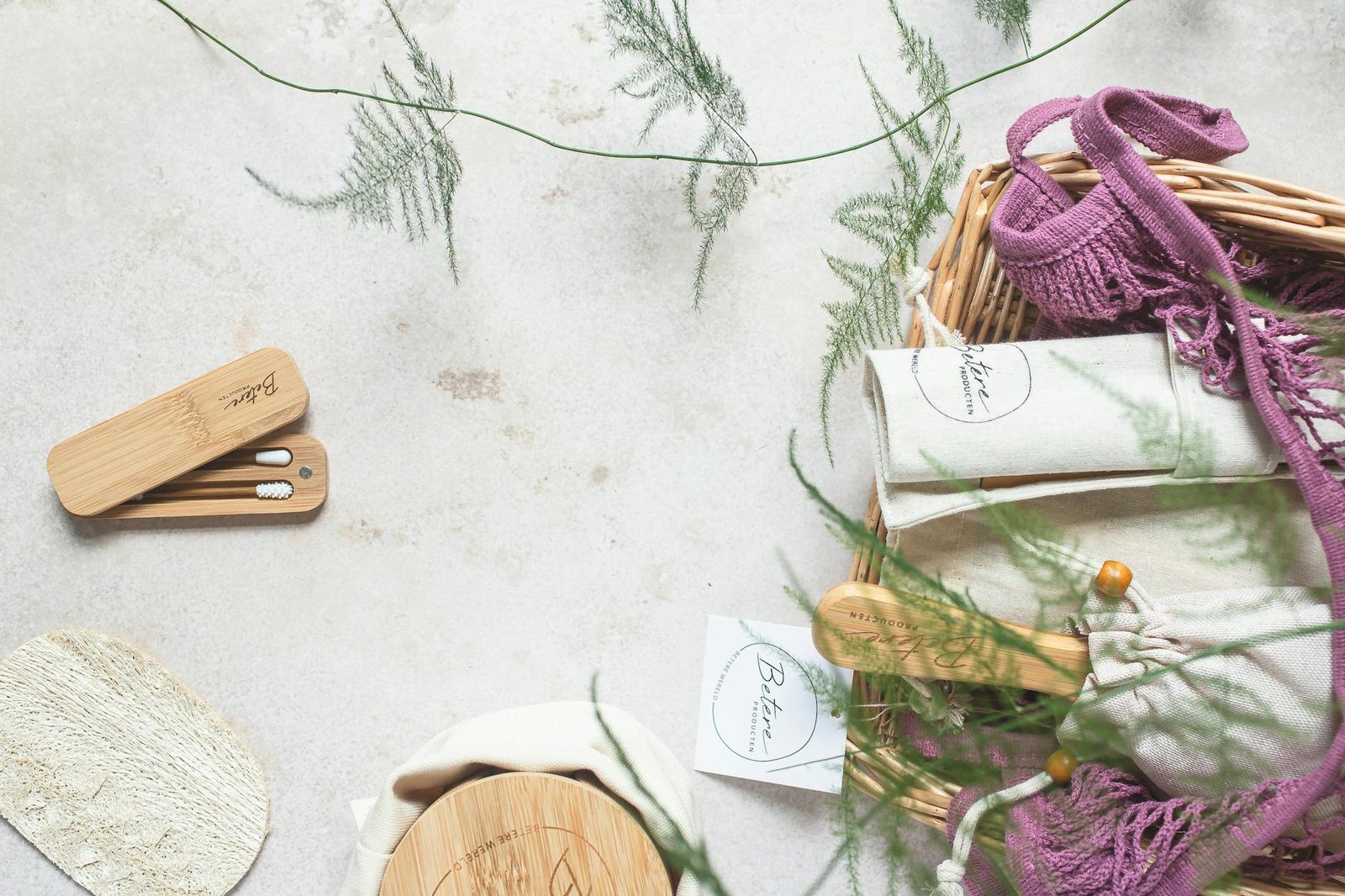 Zero waste set featuring reusable bamboo hygiene products, showcasing sustainable living on a white surface.