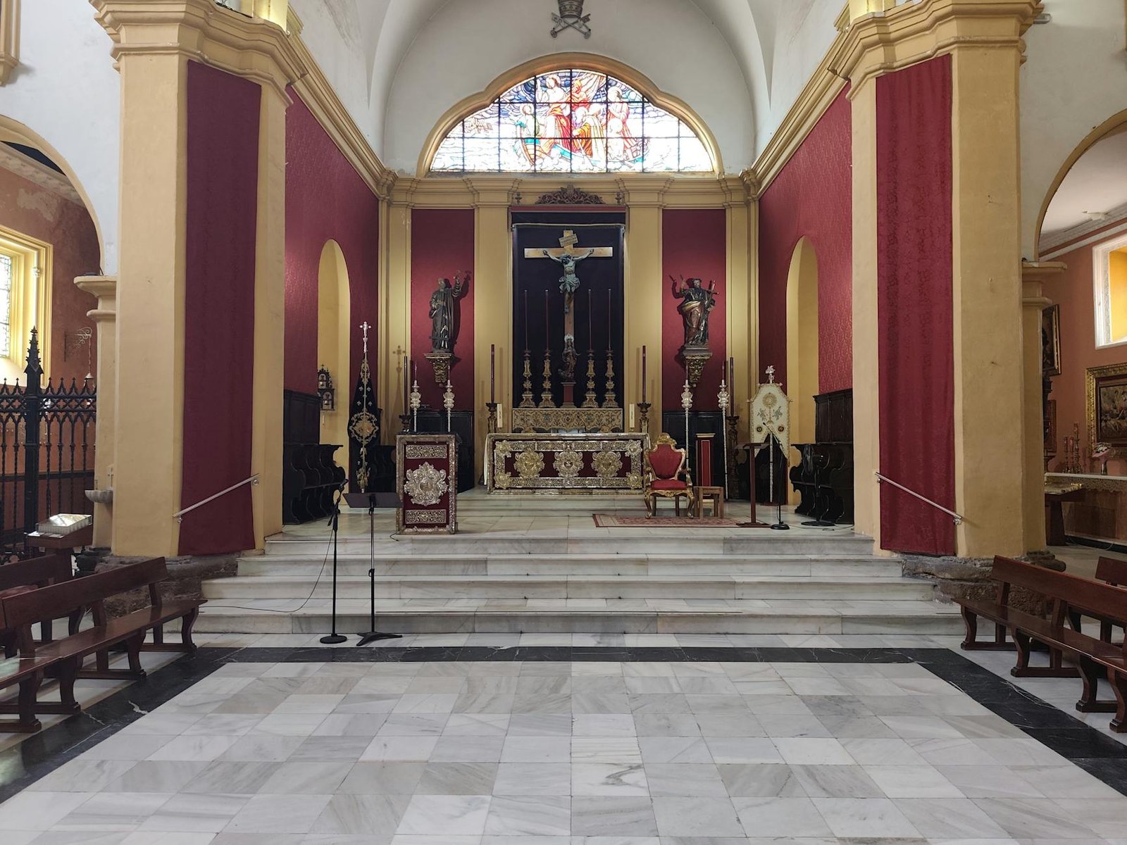 Explore the ornate interior of a historic Catholic church in San Fernando, Spain.